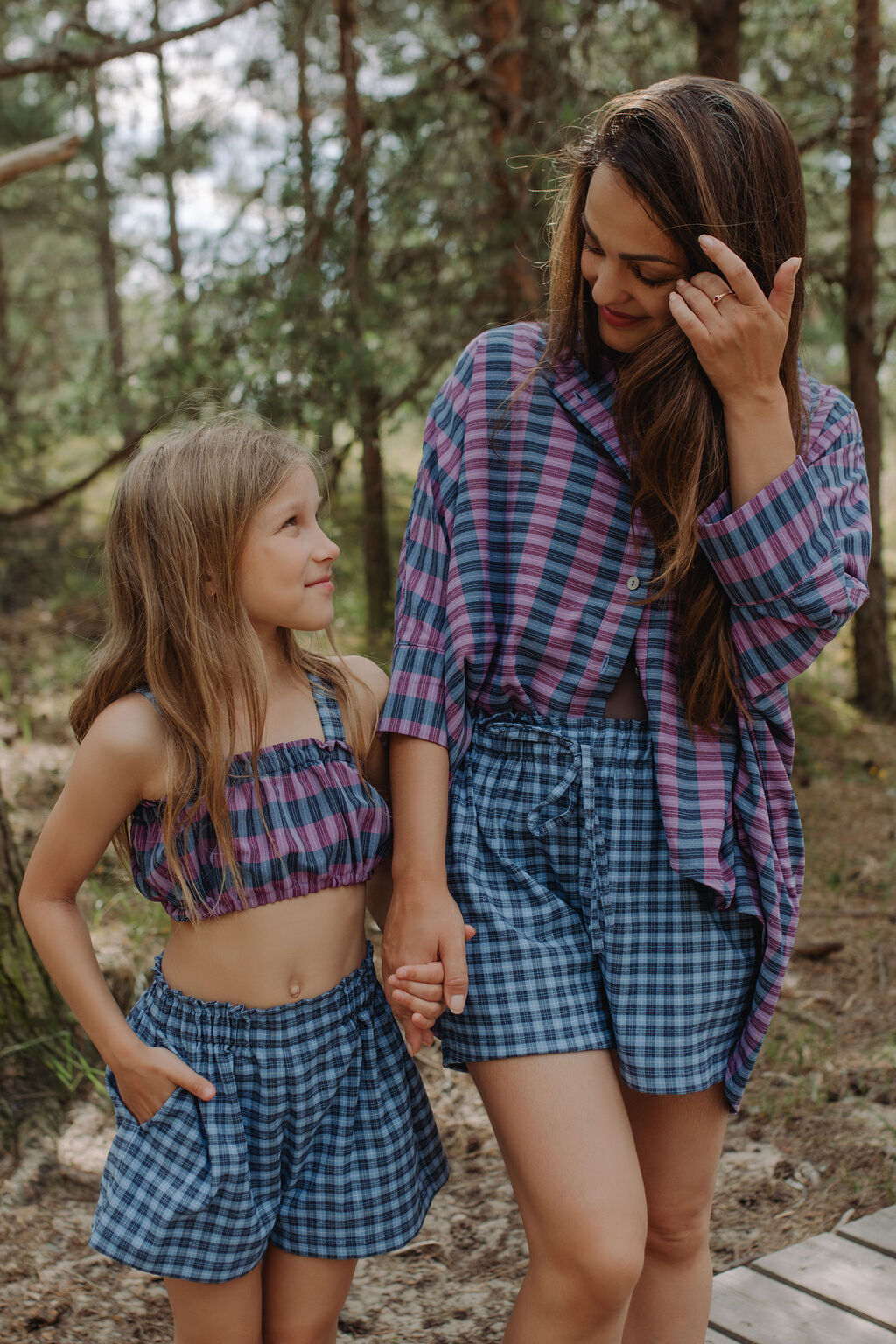 Mother and child wearing matching blue check shorts, Mini Me sustainable fashion