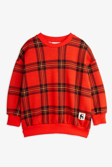 Mini Rodini organic cotton kids sweatshirt with rib trims is made from 100% GOTS certified organic cotton, ensuring the highest quality and sustainability. Featuring a bright red check pattern, this sweatshirt is perfect for the current season. Shop organic cotton kids clothing.