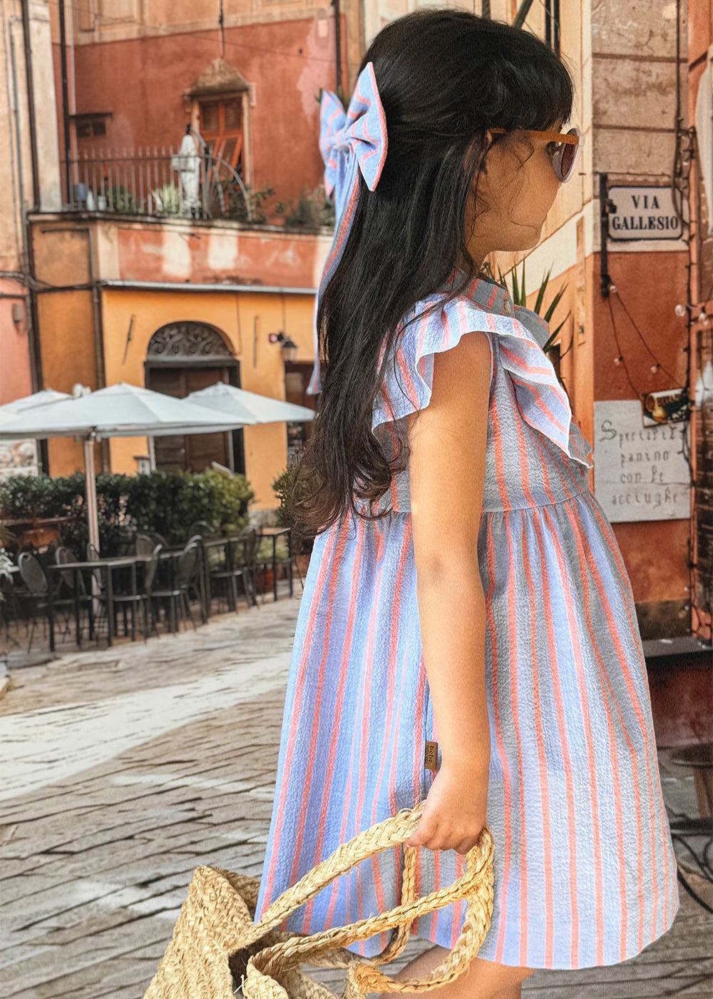 Close-up of oversized ruffle collar on pink and blue stripe organic cotton girls dress by Milimilu