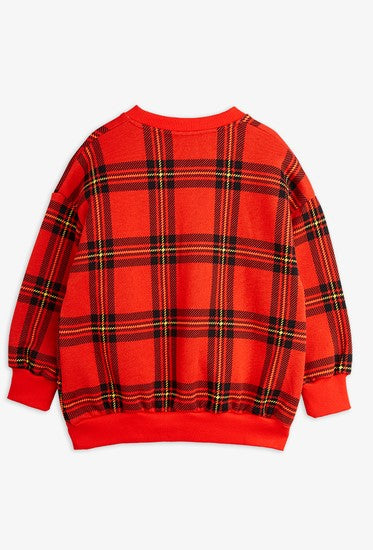 Mini Rodini organic cotton kids sweatshirt with rib trims is made from 100% GOTS certified organic cotton, ensuring the highest quality and sustainability. Featuring a bright red check pattern, this sweatshirt is perfect for the current season. Shop organic cotton kids clothing.