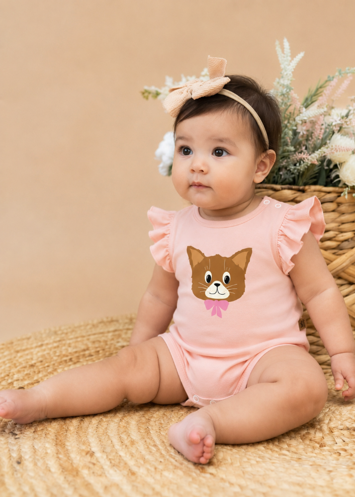 	Flat lay of pink cat print baby bodysuit – soft 95% organic cotton with flutter sleeves, made in Latvia