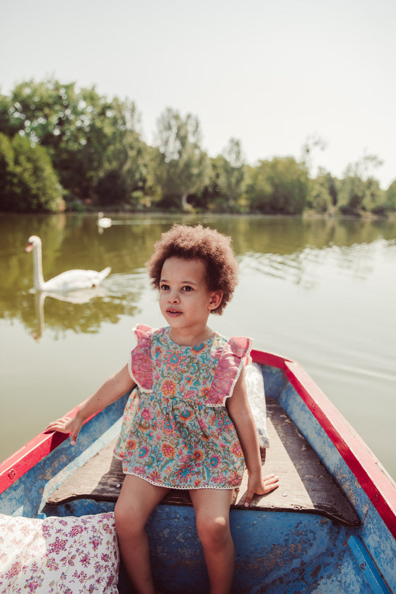 Organic cotton baby romper in water flower pink colour by Louise Misha. Mini Me  fashion to  match with your baby. The best gifts for baby and baby presents.