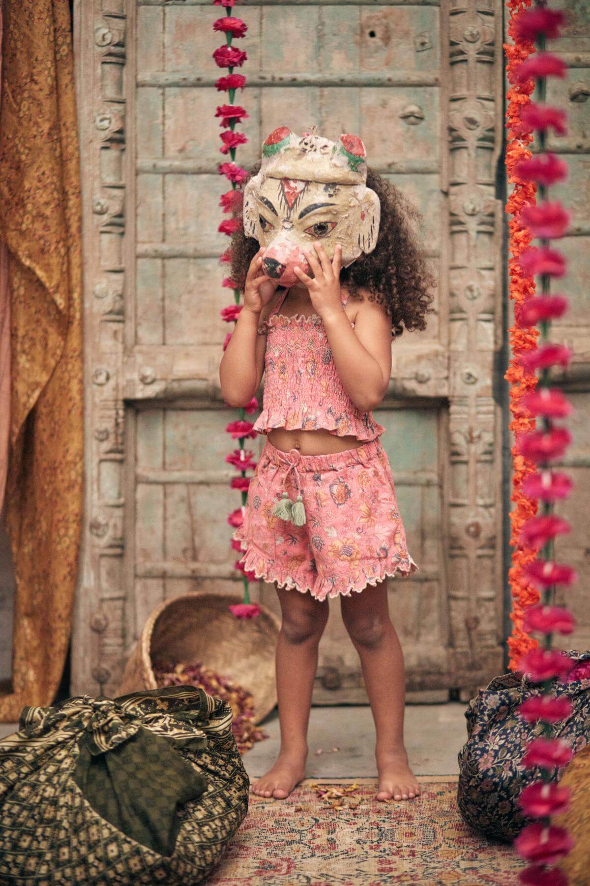 Organic cotton girl shorts in pink, breathable with elasticated waist by Louise Misha. Best kids sustainable clothing & organic cotton kids clothing online.