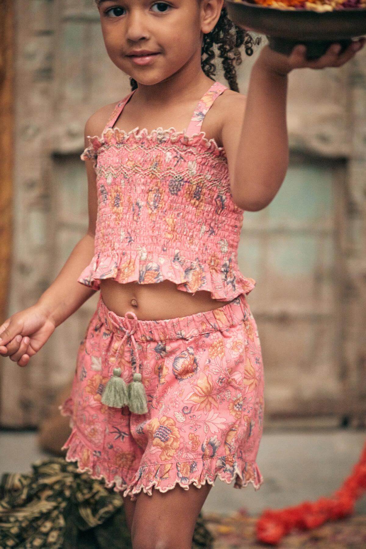 Organic cotton girl shorts in pink, breathable with elasticated waist by Louise Misha. Best kids sustainable clothing & organic cotton kids clothing online.