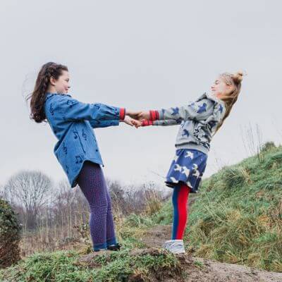Organic cotton girls & teen mini skirts in blue colour with all-over bird print online at MiliMilu Lifestyle. Sustainable kids fashion & organic cotton clothing