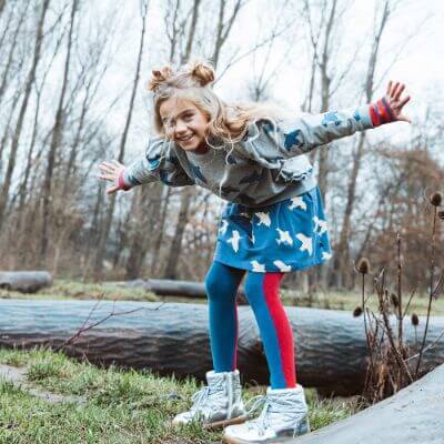 Organic cotton girls & teen mini skirts in blue colour with all-over bird print online at MiliMilu Lifestyle. Sustainable kids fashion & organic cotton clothing