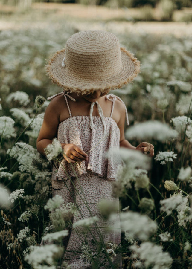 Girl wearing organic muslin flower print dress — lightweight breathable Back to Nature dress by Tiny Bunny | MiliMilu kids fashion