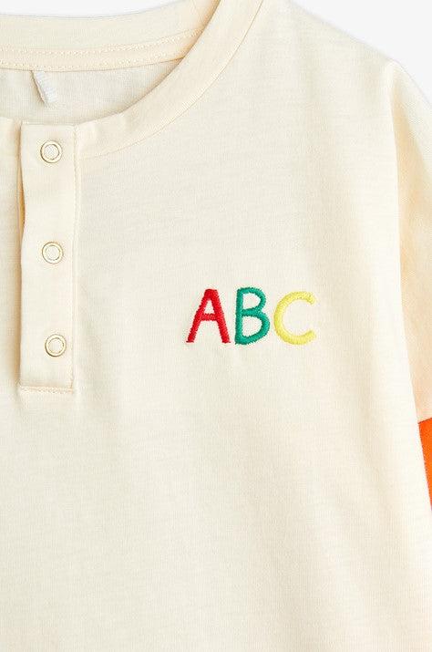 Mini Rodini long-sleeved shirt is made from 100% GOTS-certified organic cotton and this long-sleeve shirt features ABC embroidery on the chest.