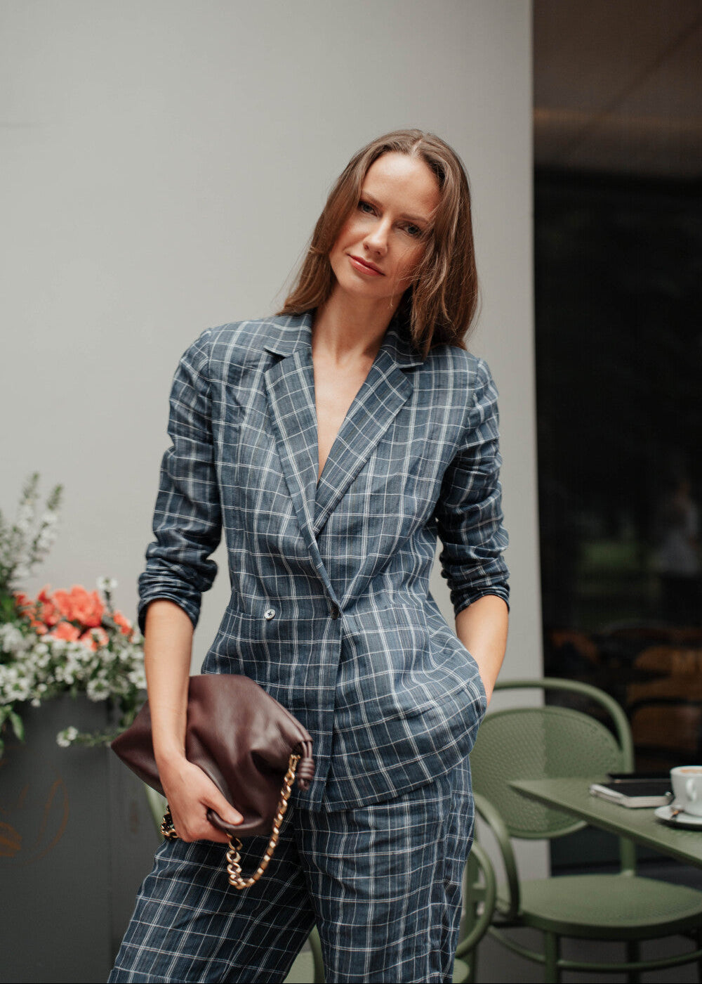 Woman wearing checkered blue organic linen blazer London style - front view