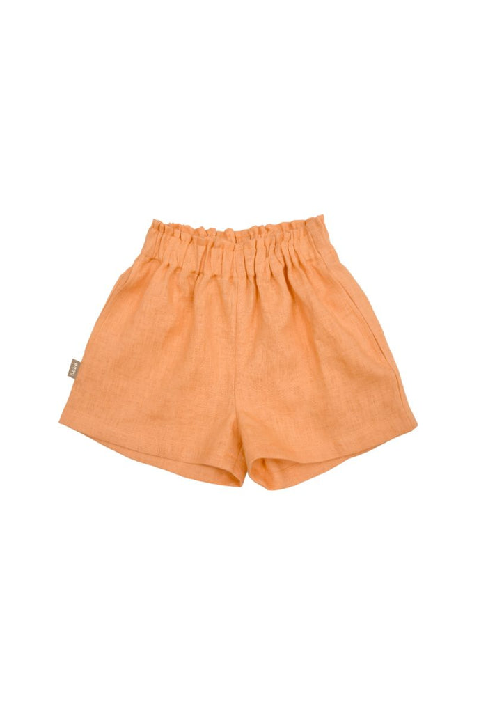 The sustainable and breathable girl's stylish linen shorts in orange colour with pockets will be the favorite and most comfortable shorts this summer. Made with high-quality European linen without any harmful chemicals in fair trade in Latvia. MiliMilu offers sustainable fashion for kids and teens from linen.