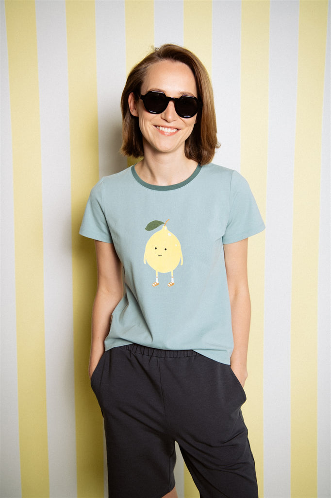  A breathable, organic cotton women's t-shirt in mint green color with fun lemon print is comfortable and stylish for everyday wear. Lightweight and perfect for hot and humid weather. Mini Me matching T-shirts and whole family matching clothing are available. MiliMilu offers sustainable fashion for the whole family.