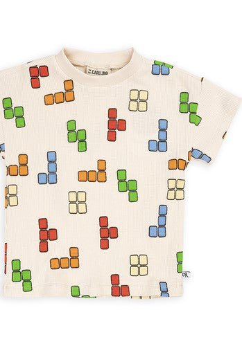 Shop the Blox Crewneck White T-Shirt is a must-have for every kid's wardrobe. With its classic Tetris-style print  t-shirt it's perfect for game-loving kids. Tailored for boys and teenagers, the collection offers a vibrant array of colors to ensure they stand out - unique kids clothing. Organic cotton t-shirt for kids.