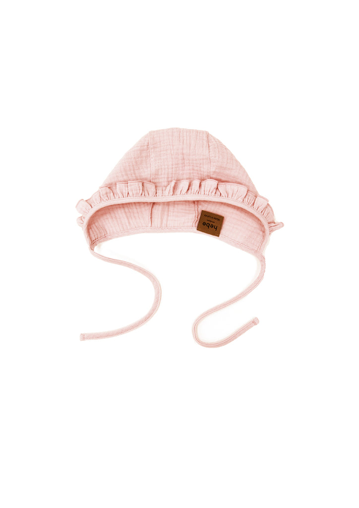 Shop the most adorable and softest baby hat for summer! Check out this organic muslin hat in soft pink, the perfect baby hat for summer. It's a baby girl hat with an adorable pink colour and ruffle. Shop the best and most comfortable baby clothing online and best baby shower gifts and new born baby gifts online.