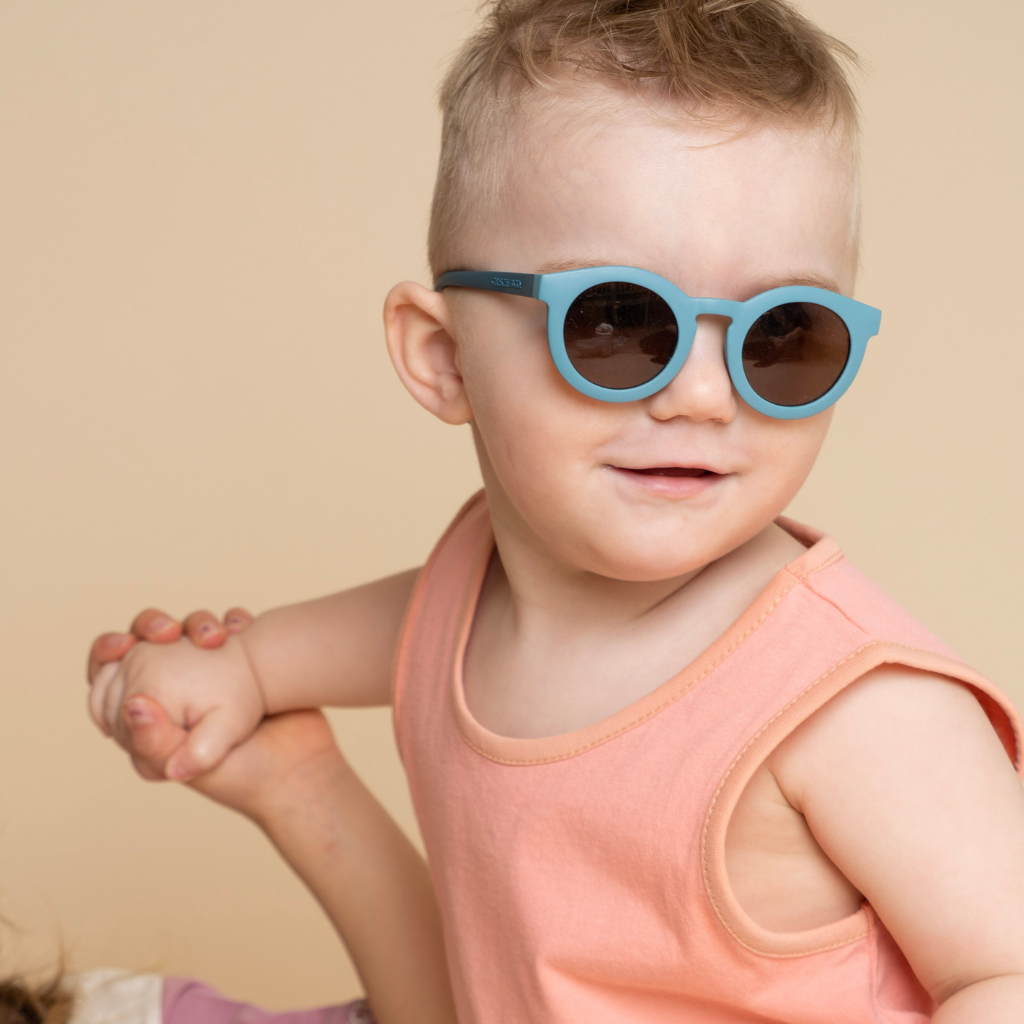 Sustainable baby sunglasses in blue in an eco-friendly/non-toxic break-resistant material with polarised lenses & UV400 protection. Family matching sunglasses.