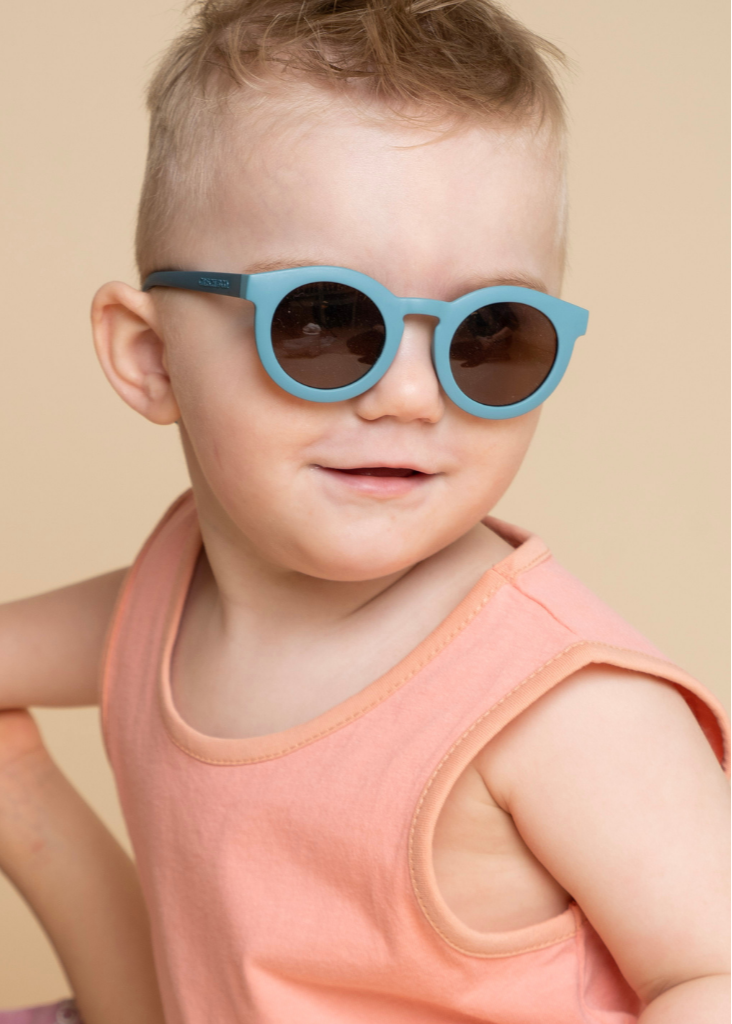 Sustainable baby sunglasses in blue in an eco-friendly/non-toxic break-resistant material with polarised lenses & UV400 protection. Family matching sunglasses.
