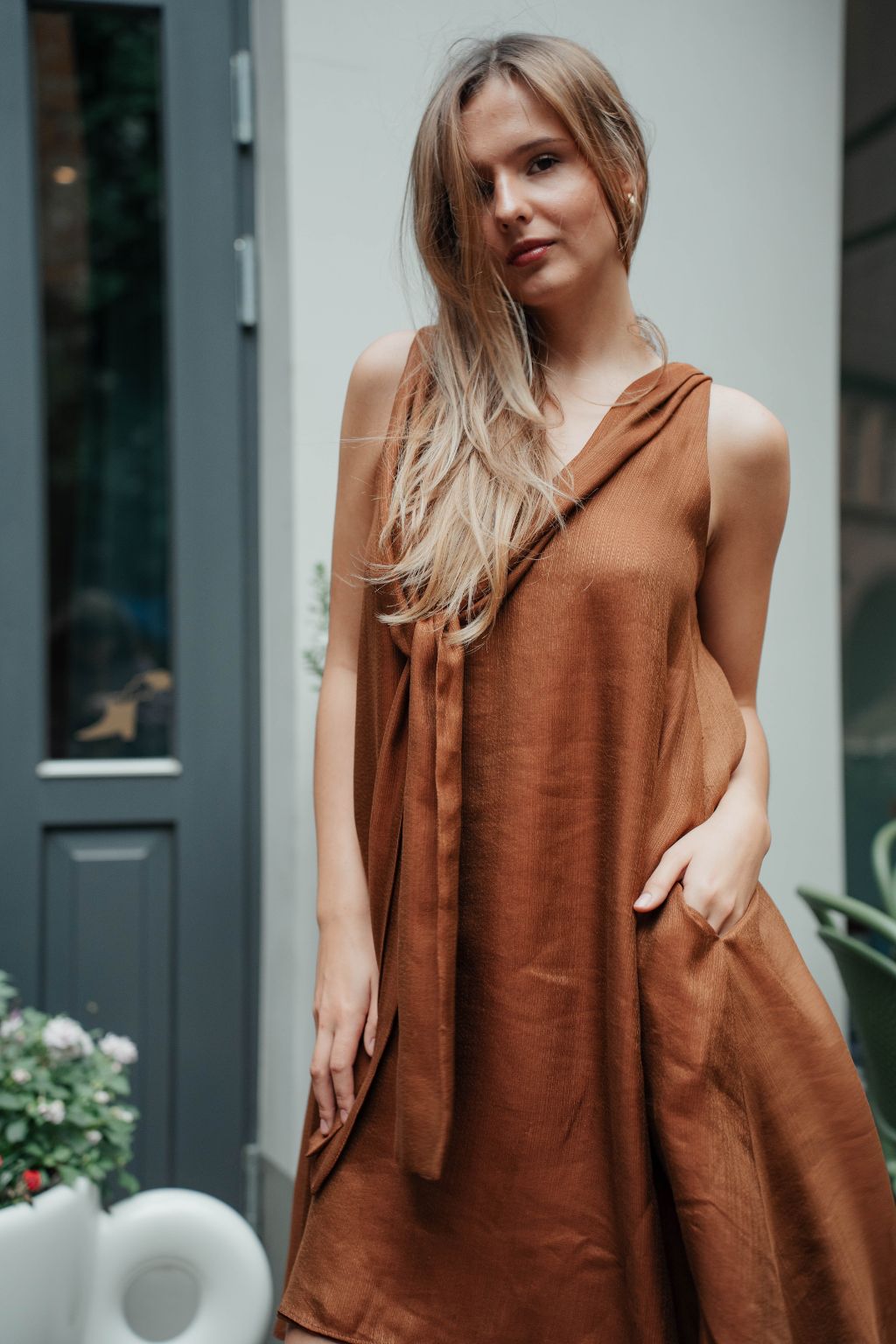 Sustainable reversible women's dress in caramel colour.