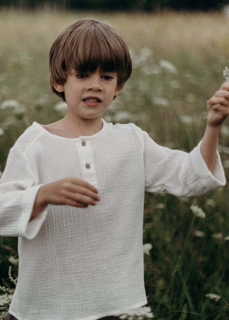 Handmade kids muslin shirt in white is made from organic cotton and is breathable and lightweight, the best clothing for hot and humid weather.