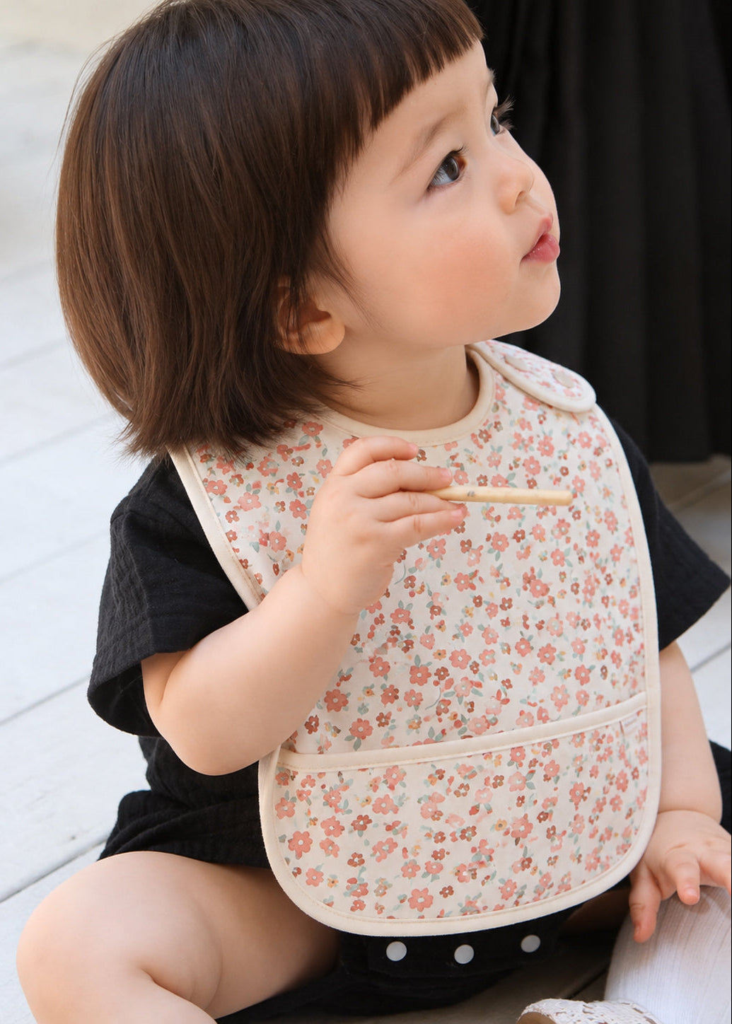 Baby bib with small pink flowers that is easy to clean and adjust - best gift for toddlers