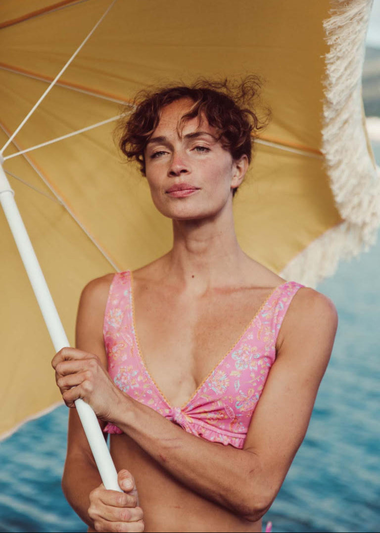 Louise Misha Ohau bikini top in Pink Mallow Romance — plunging V-neck with decorative bow, front view