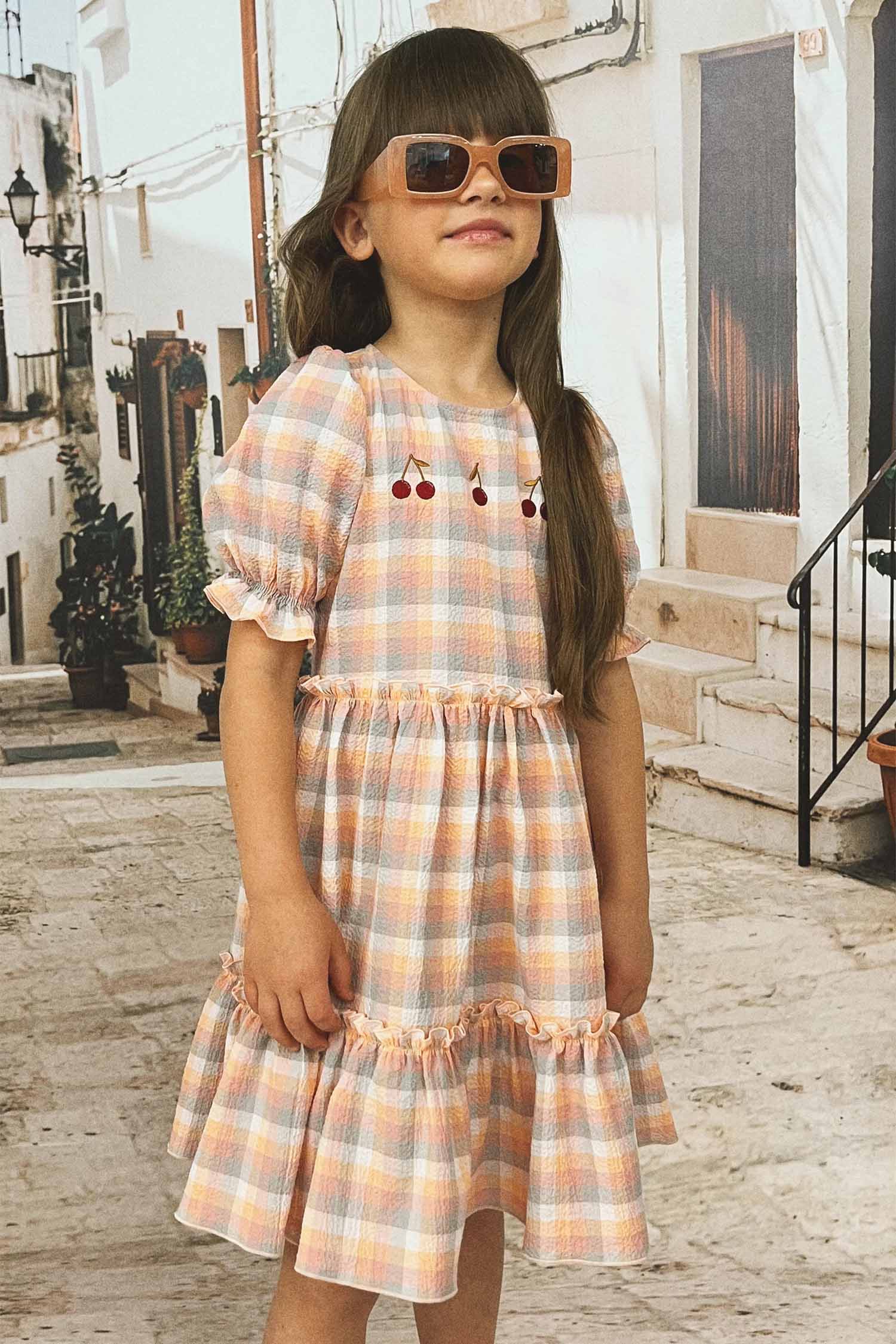 Puffed sleeve dress for girls with ruffle skirt makes a perfect girl summer dress. Making it perfect for  kids summer clothing collection. Best girl dresses.