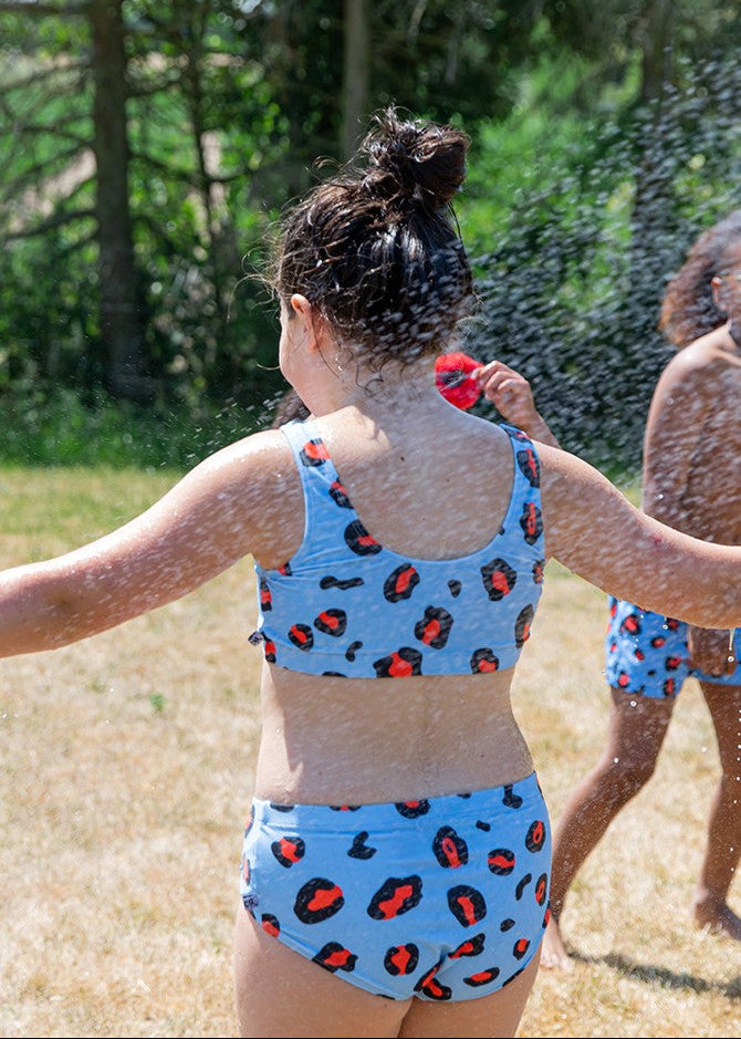 Leopard print girl bikini detail view - sustainable kids swimwear made from 100% recycled polyester