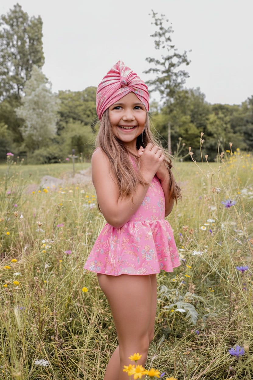 Girls pink one-piece swimsuit in Pink Mallow Romance print by Louise Misha – SPF 50 recycled fabric