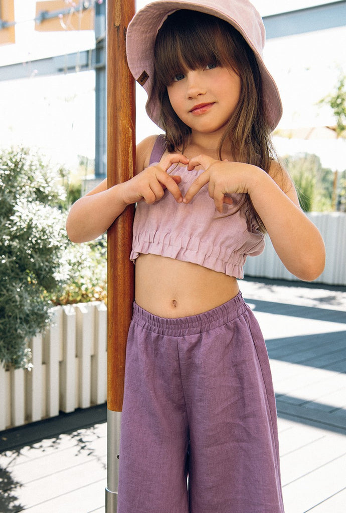 Shop sustainable and breathable girl's stylish linen crop top, a trendy crop top for girls in lilac colour with purple straps, will be her favourite crop top this summer. Our collection features trendy crop tops and cool linen tops and kids swimwear. Shop the best kids summer clothing online at MiliMilu.