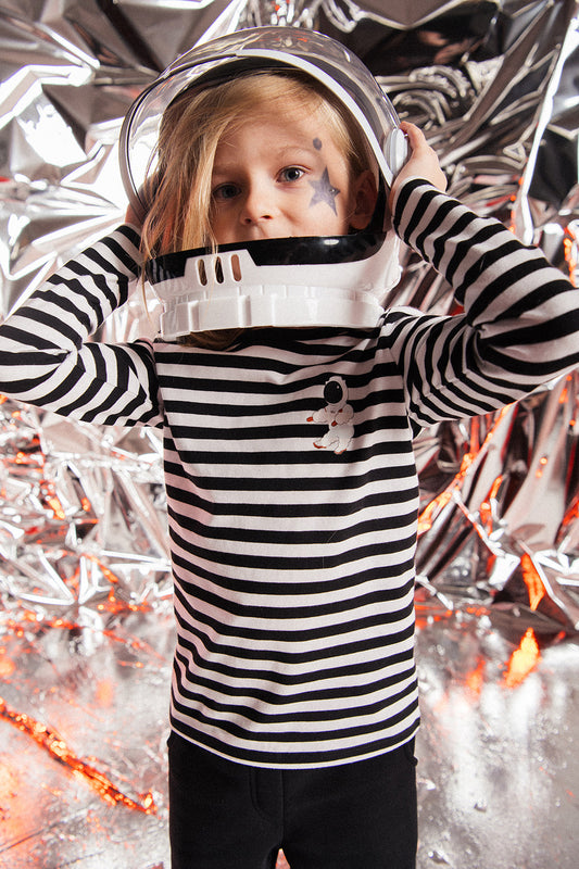 Kids long sleeve top with black & white stripes with astronaut print, sustainable kids clothing line is trendy. Shop the best kids clothing online at MiliMilu.