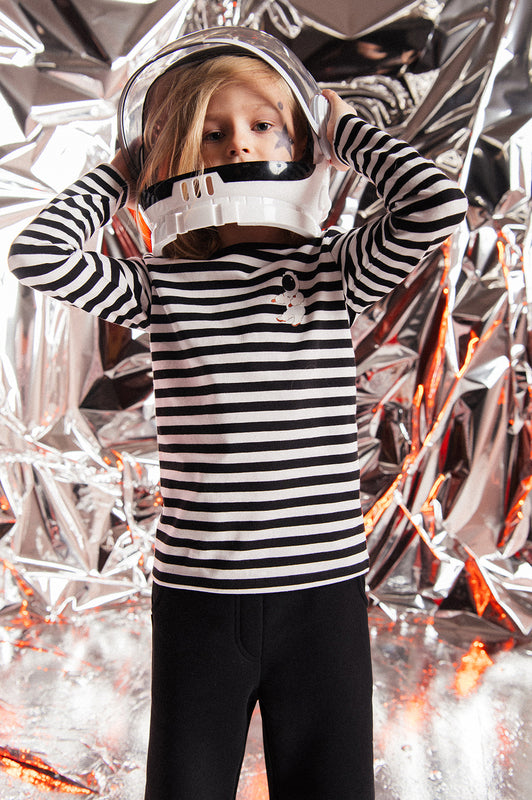 Shop kids long sleeve top with black and white stripes with astronaut print, our sustainable kids clothing line isn trendy and easy to wear and practical. Shop the best kids clothing and kids gifts and presents online.