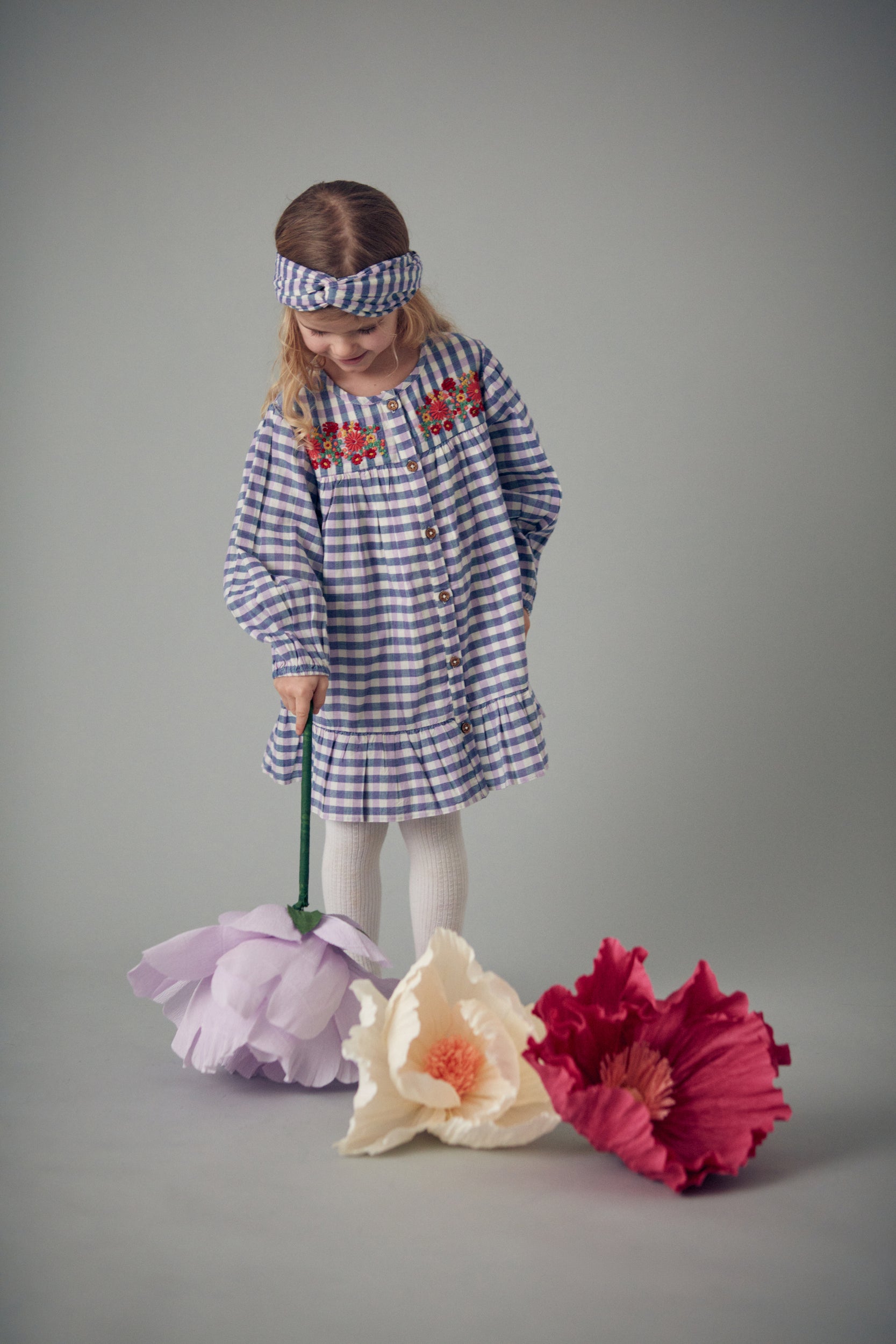 Shop organic cotton checker dress with embroidery in blue and purple colours by Louise Misha. Shop sustainable kids fashion and organic cotton kids clothing made for trendy kids for practical parents.