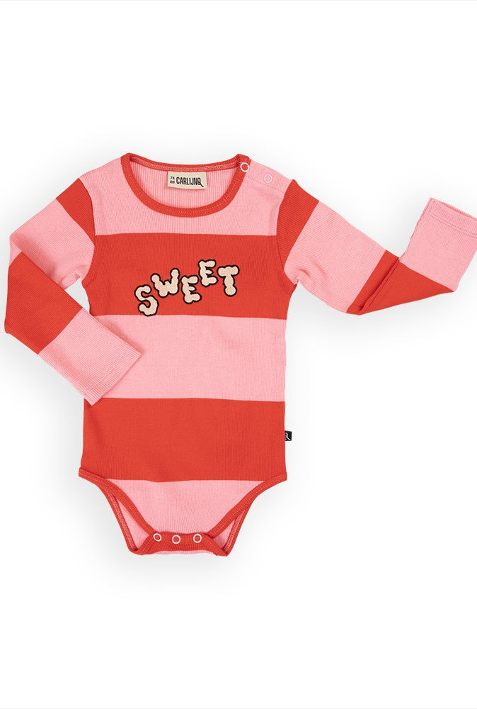 Organic cotton baby clothing featuring adorable pink baby girl bodysuit. Made with stretchy GOTS-certified cotton for sensitive and eczema prone skin.