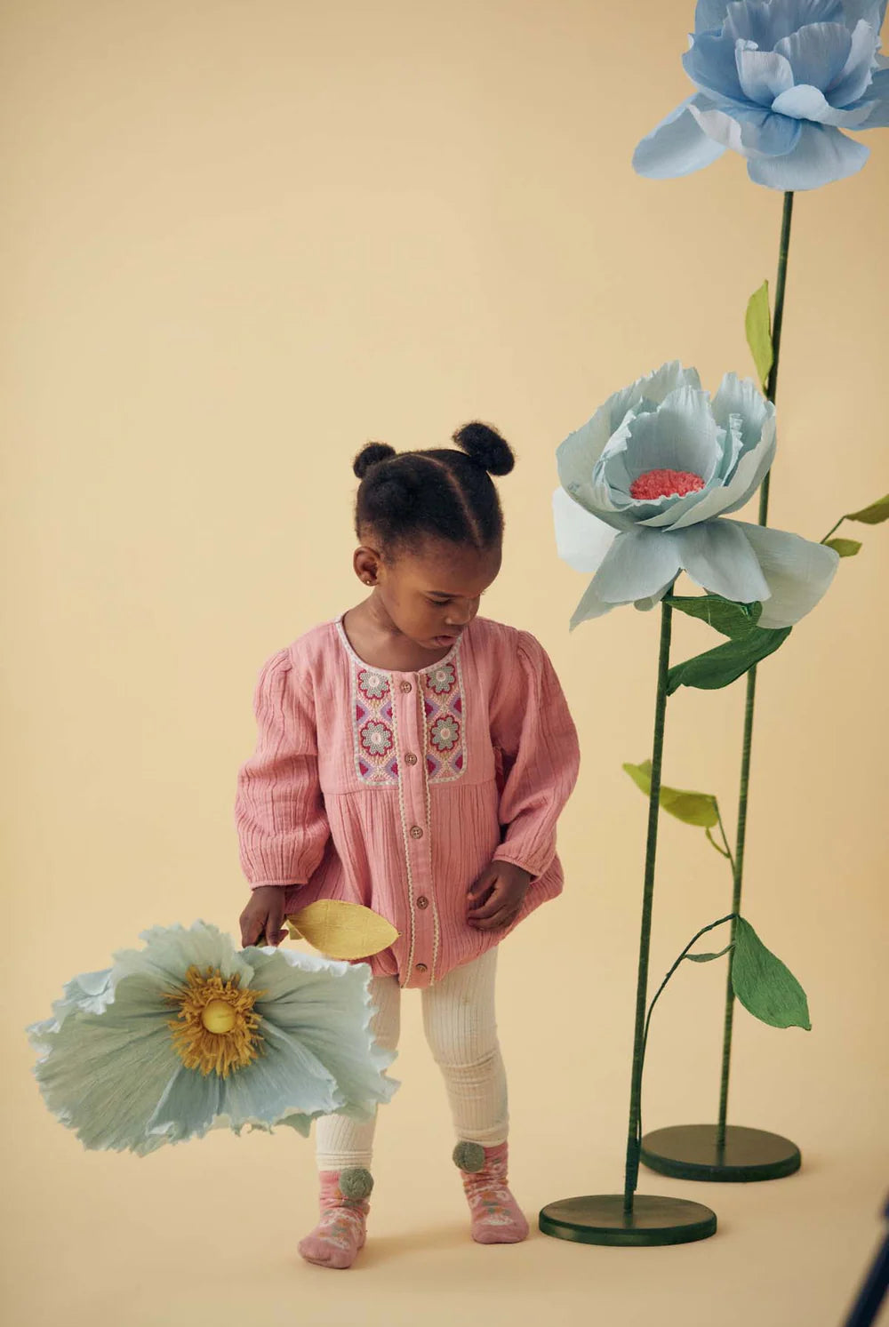 This adorable light pink romper for baby girls features graphic embroideries is made with soft fabric double gauze organic muslin, using organic cotton (GOTS) by Louise Misha. The best baby gift and presents for babies online.