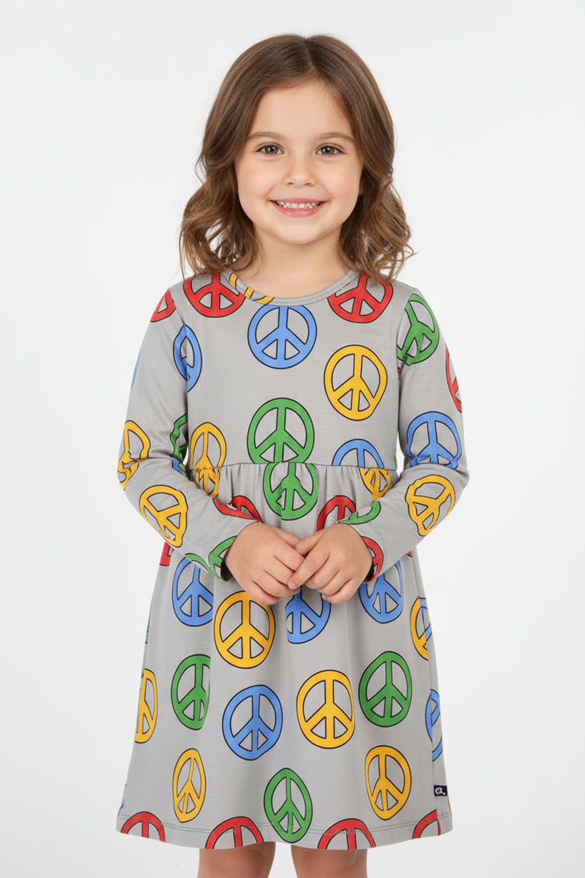 Girl wearing CarlijnQ Peace long sleeve skater dress in organic cotton
