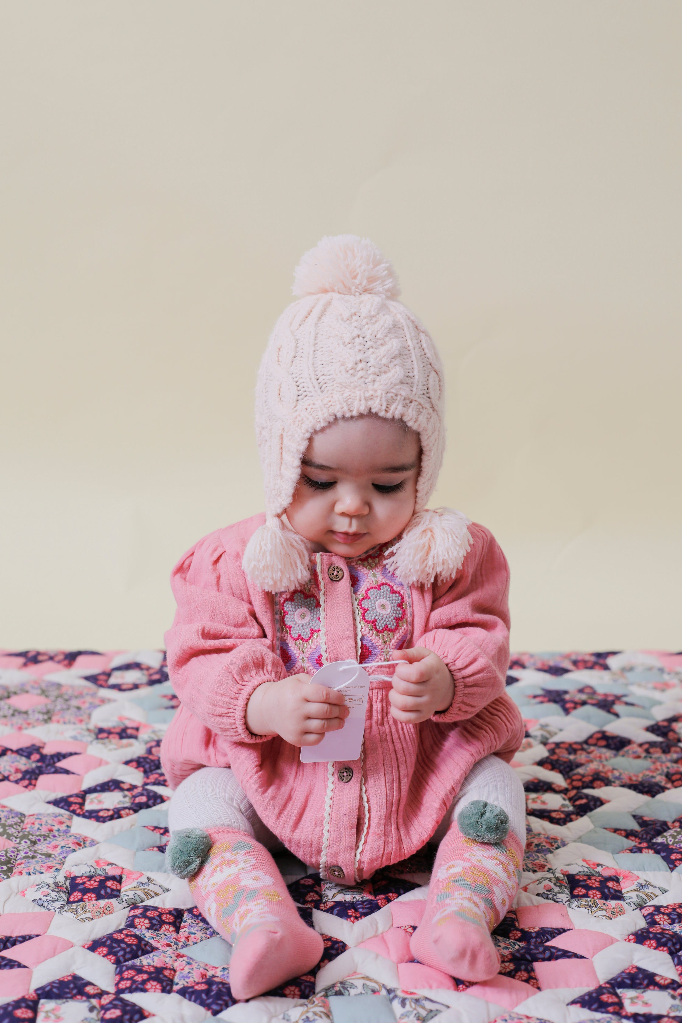 This adorable light pink romper for baby girls features graphic embroideries is made with soft fabric double gauze organic muslin, using organic cotton (GOTS) by Louise Misha. The best baby gift and presents for babies online.