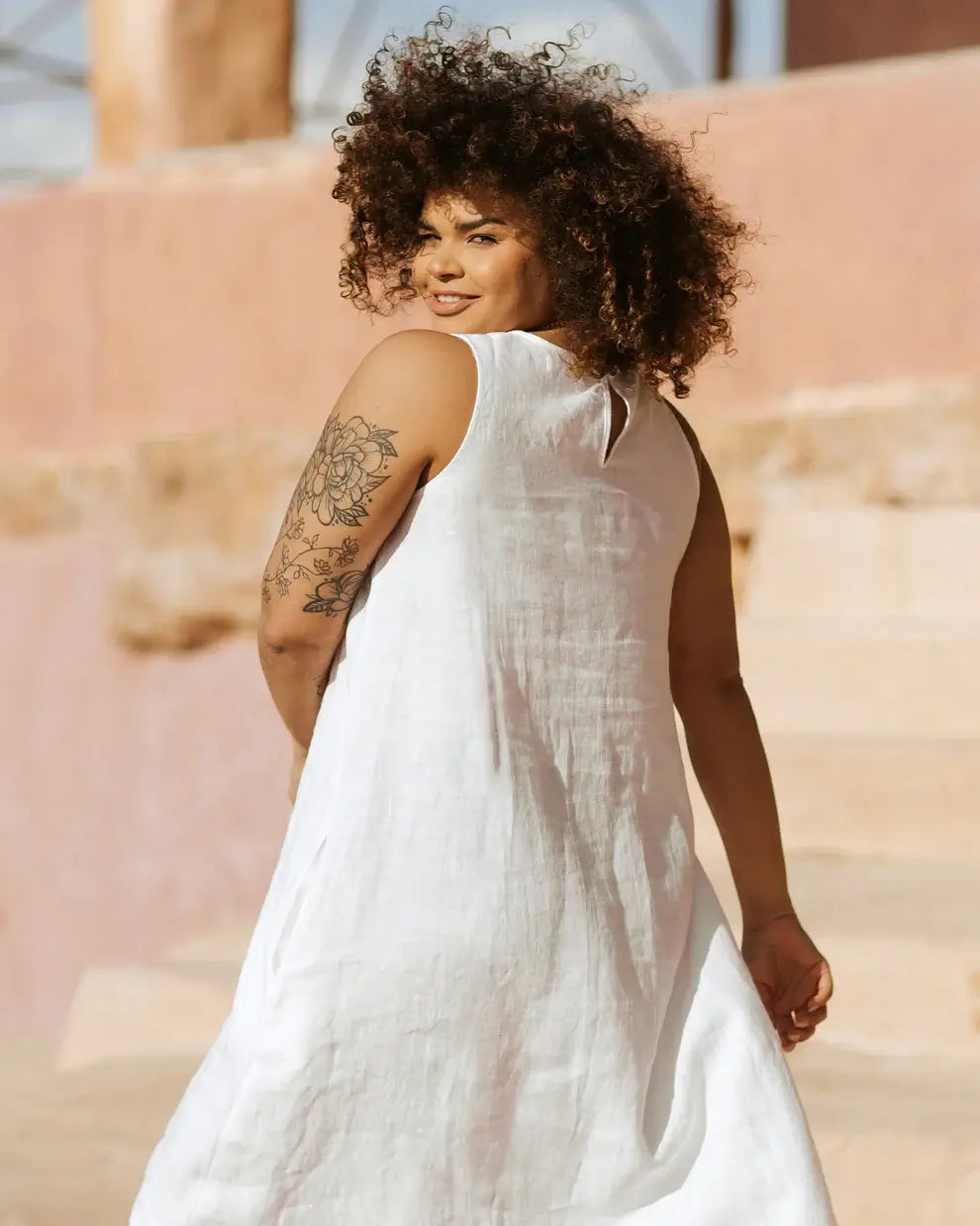 The sustainable women's dress by Magic linen, the white women's linen dress is made with the highest quality, breathable sustainable linen in fair trade. Free fit and flowy women's linen dress, timeless linen dress for women. Best linen dress for hot and humid weather. White linen dress for stylish women from MiliMilu.