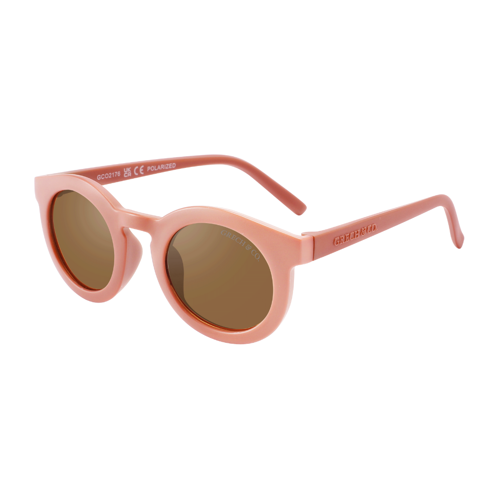 Shop sustainable baby sunglasses in pink colour by Grech & Co. These eco-friendly sunglasses have polarised lenses and UV400 protection from the sun. Sustainable baby girl sunglasses are the best summer accessories. Mini-me sunglasses and Mommy and Me matching are available. Best baby presents and gifts.