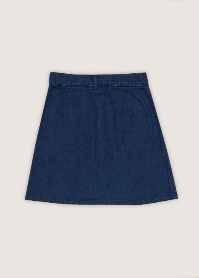 Womens sustainable denim mini skirt detail shot, showcasing lightweight BCI cotton fabric and high waisted design.