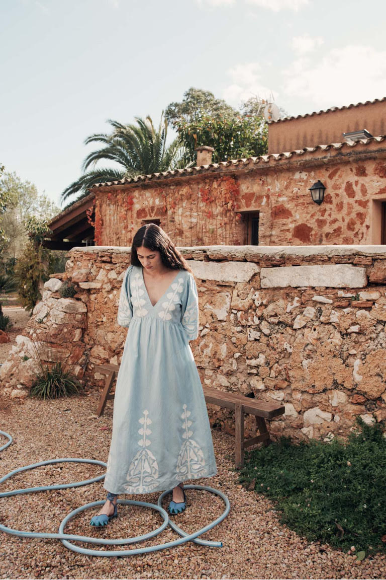 Women maxi dress in blue is the best summer dress with open back. The Ilana maxi dress has a deep V-neck & contracted embroideries on the front by Louise Misha.