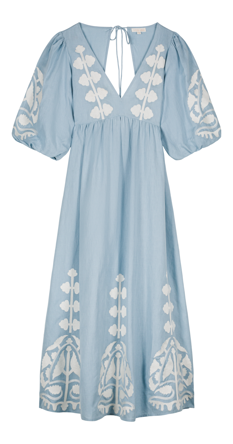 TWomen maxi dress in blue is the best summer dress with open back. The Ilana maxi dress has a deep V-neck & contracted embroideries on the front by Louise Misha.