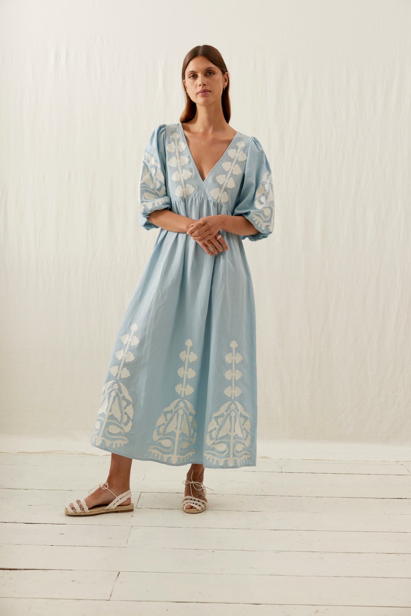 Women maxi dress in blue is the best summer dress with open back. The Ilana maxi dress has a deep V-neck & contracted embroideries on the front by Louise Misha.