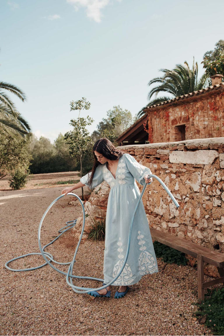 Women maxi dress in blue is the best summer dress with open back. The Ilana maxi dress has a deep V-neck & contracted embroideries on the front by Louise Misha.
