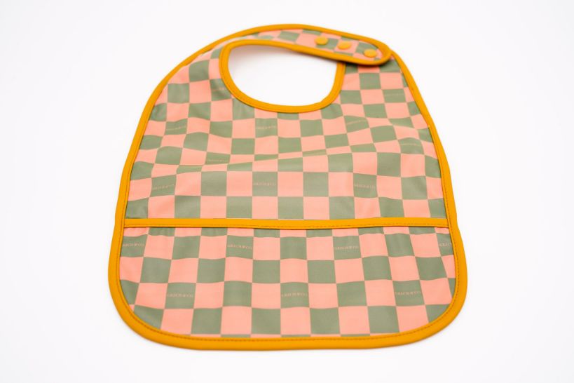 Shop eco-friendly and very stylish baby bibs online now in Hong Kong and Singapore in stylish colours. We love the bright checked print. Our baby bibs are practical, easy-to-clean baby bibs that keep mealtimes cleaner. Made of safe and gentle-to-skin recycled materials by Grech & Co. 