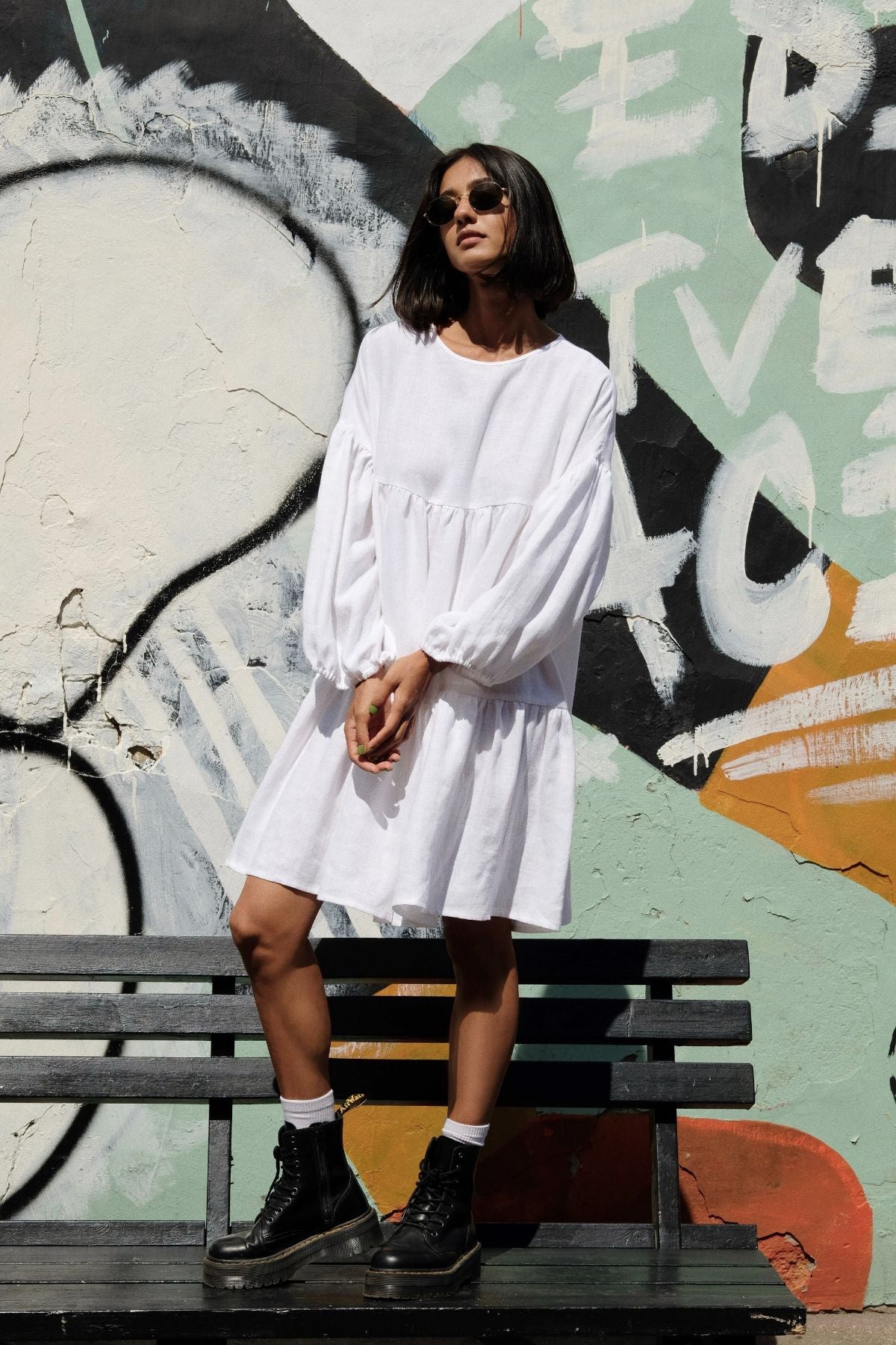 Slow fashion women's linen dress with long sleeves in white color from the highest quality linen. Feminine women's linen dress with volume and for fashionable women. Sustainable women's linen dress from breathable linen by MiliMilu in Hong Kong and Singapore.