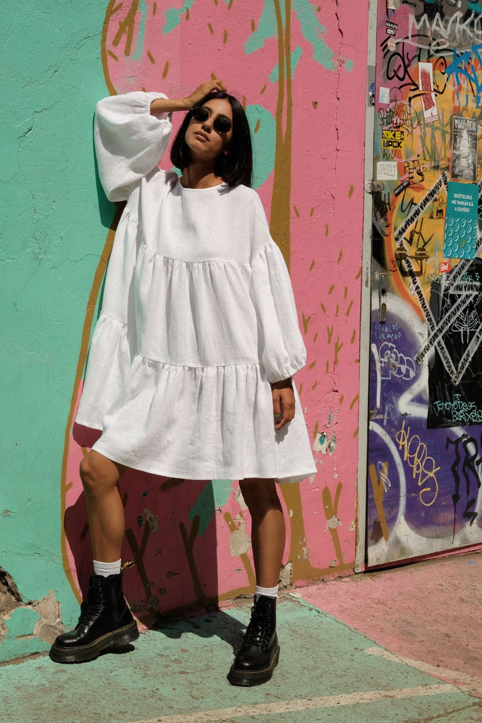 Slow fashion women's linen dress with long sleeves in white color from the highest quality linen. Feminine women's linen dress with volume and for fashionable women. Sustainable women's linen dress from breathable linen by MiliMilu in Hong Kong and Singapore.