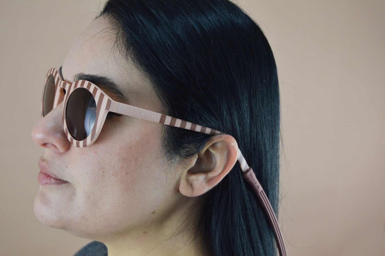 Sustainable sunglasses in pink and red for women by Grech & Co are eco-friendly with polarised lenses and UV400 protection. Mini Me styles are available.