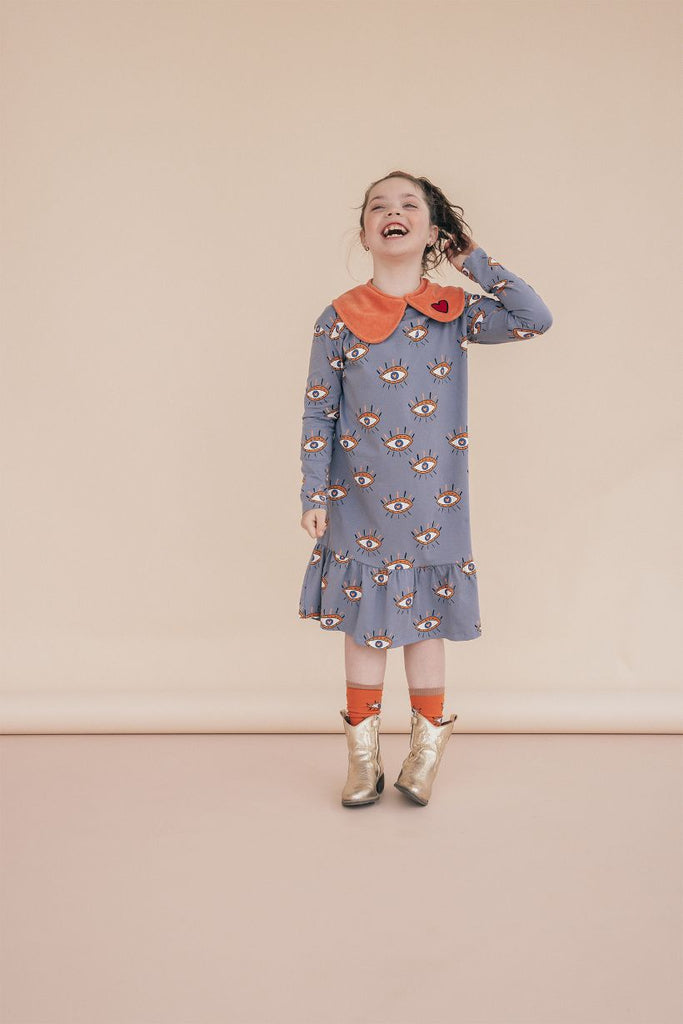 Shop stylish, practical and comfortable long organic cotton girl's dress with heart eyes ( third eye magic!) online in Hong Kong and Singapore at MiliMilu. This heart eye long sleeve and midi dress is made for stylish girls, to wear from parties to climbing trees. Shop stylish and practical kids' clothing and gifts.