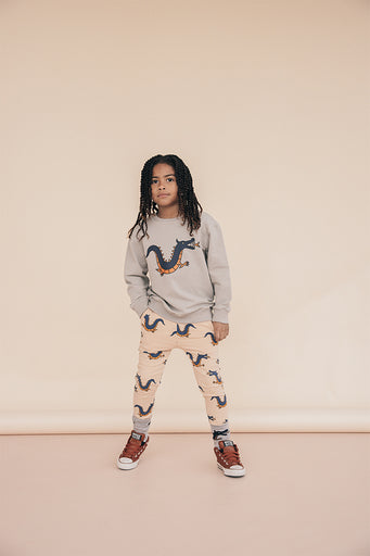 The organic cotton kids' joggers with dragon print is a must-have for every kid's wardrobe, comfortable and soft, made with organic cotton by CarlijnQ. Stylish and cool kids, teen joggers, pants, and other organic cotton kids clothing online at MiliMilu in Hong Kong and Singapore.
