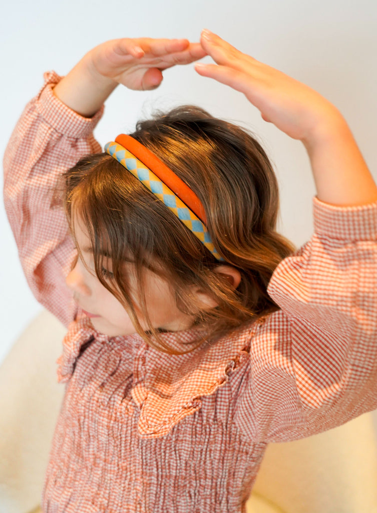 Two headbands are made with organic cotton ( Oeko tex). They feature a fun combination of colors and prints made by Grech&Co. They are perfect headbands for stay-at-home days, styled-up hair days, messy hair days, and all the days in between. They are light, stylish, and fun and made from organic cotton and are kind to our hair and nature.