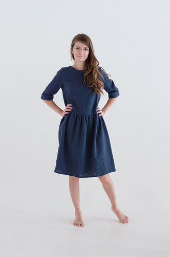  Artisans beautifully handcraft women's dresses in navy colour from organic muslin with 3/4 sleeves. Mini-me dresses are available on Mommy and daughters' days out! Organic muslin protects you from son and is very breathable- perfect for hot and humid weather. MiliMilu offers sustainable women fashion and women dresses.