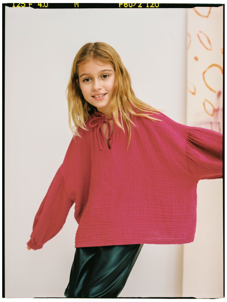 Pink sustainable girl's blouse is stylish and comfortable. It is made with organic cotton chiffon with a tie-dye print in burgundy. The Olivia girl blouse is perfect for being back to school and catching up with friends on playdates. Our favorite - Mommy and Me style is available. Perfect kids clothing for cooler weather.